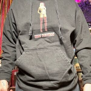 Kim Petra’s Christmas hoodie HIT IT FROM THE BACKBlack Hoodie with Graphic Print